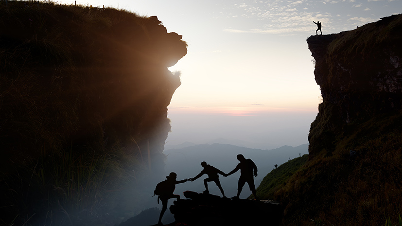 Male,Hiker,Celebrating,Success,On,Top,Of,A,Mountain,In